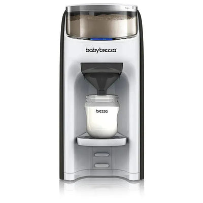 Baby Brezza Baby Formula Pro Advance, a automatic formula maker dispensing formula into a glass bottle.