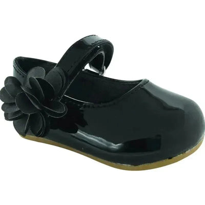 Black patent leather baby shoes with a decorative flower, featuring a strap for secure fastening.
