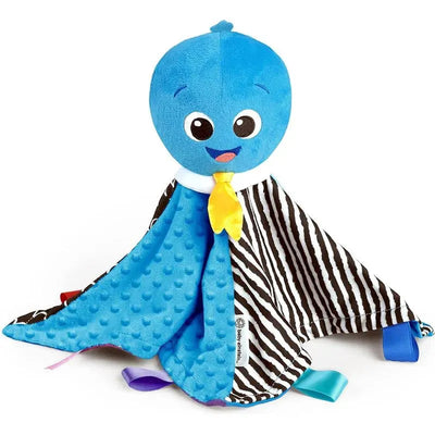 Blue plush octopus with a friendly face, yellow tie, and zebra-patterned blanket, designed for sensory play.