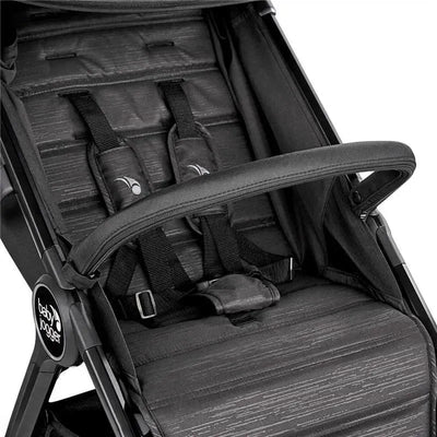 Baby Jogger City Tour 2 Single Belly Bar attached to a stroller seat with safety harness and black fabric details.