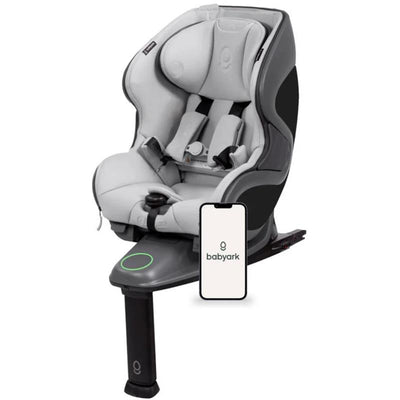 Smart convertible car seat in charcoal grey and glacier ice, featuring adjustable safety harness and a connected smartphone interface.