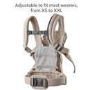 BabyBjörn Baby Carrier Harmony in Light Beige, adjustable for wearers from XS to XXL, featuring padded shoulder straps and a mesh panel.