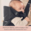Babybjorn Baby Carrier Mini in black 3D mesh, showing a baby comfortably nestled, highlighting soft, breathable fabric.