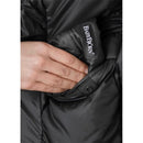 Black BabyBjörn Winter Cover for Baby Carrier with a hand placing it in a pocket, showing branding detail.