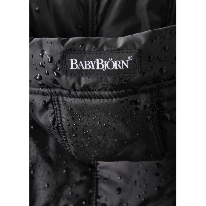 Black BabyBjörn Winter Cover for Baby Carrier, featuring a logo patch and water droplets on the surface.