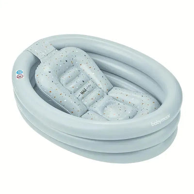 Inflatable baby bathtub and pool by Babymoov, featuring a soft padded seat with a speckled gray design.
