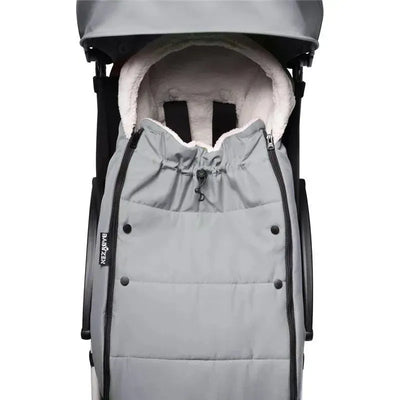 Babyzen Yoyo Footmuff in stone color, featuring a zippered enclosure and soft, plush interior for baby comfort.