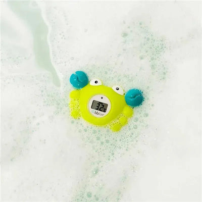 Bbluv Krab 3-in-1 thermometer and bath toy floating in bubbly water, displaying a temperature of 32°C.