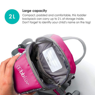 Toddler backpack in pink with a padded interior and a 2L storage capacity, featuring a name tag inside.