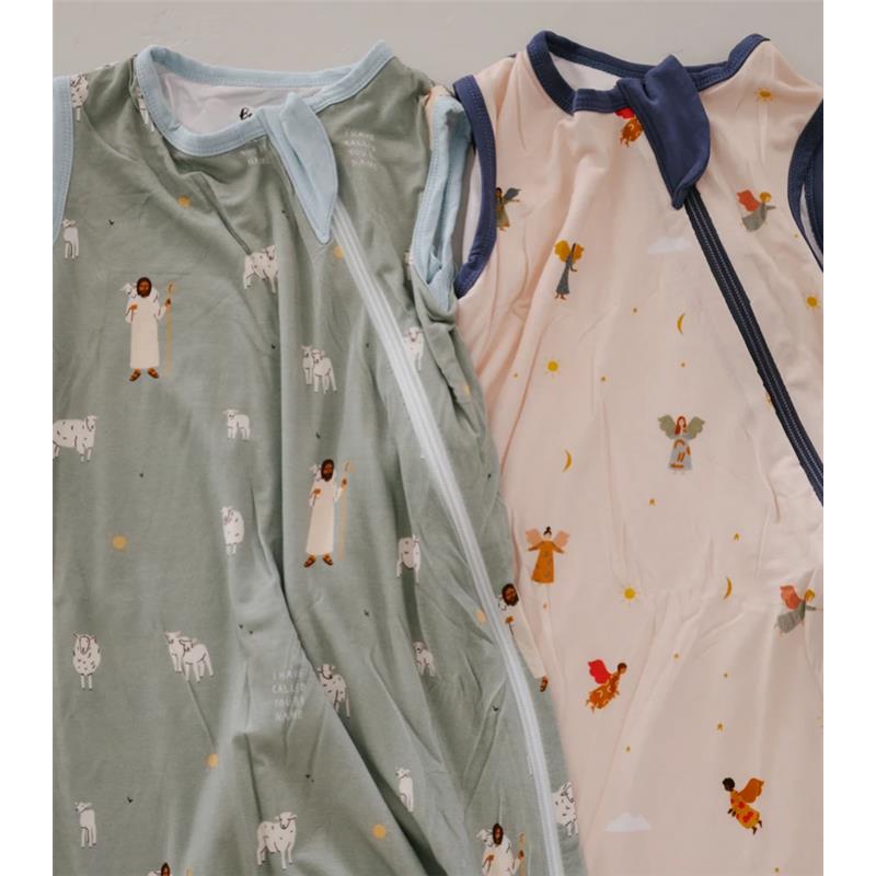 Two baby sleep sacks with 0.5 Tog warmth; one green with animal prints, the other beige with angel designs.