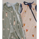 Two baby sleep sacks with 0.5 Tog warmth; one green with animal prints, the other beige with angel designs.