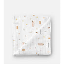 Muslin swaddle baby blanket featuring pastel illustrations of Jesus and Christian symbols on a white background.