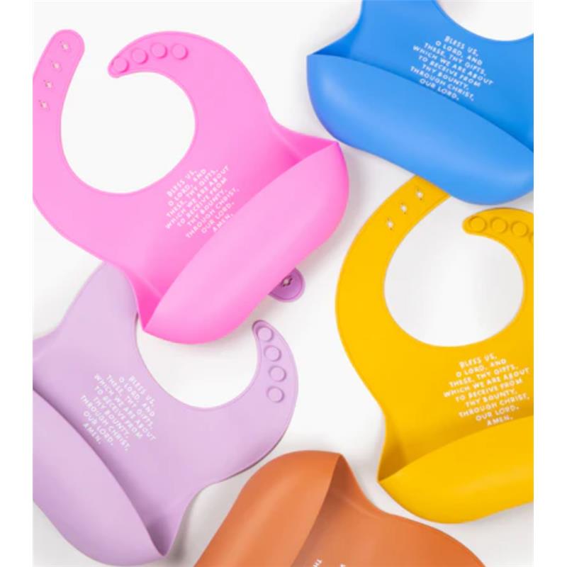 Silicone bibs in various colors including sage green, featuring blessing text for mealtime.