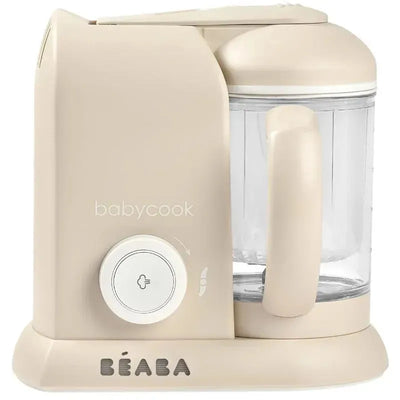 Beaba Babycook Solo 4 in 1 baby food maker in oat color with a transparent mixing bowl and control dial.