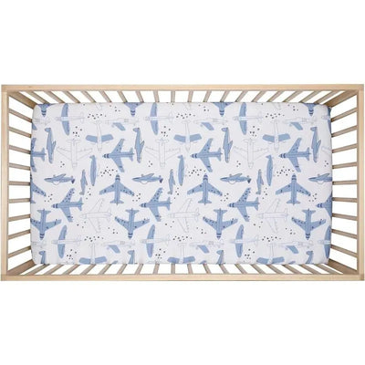 Crib sheet featuring a playful airplane pattern in blue tones, designed for infants.