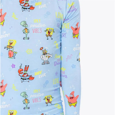 Bamboo kids pajamas featuring colorful Spongebob Squarepants characters and positive phrases on a light blue background.