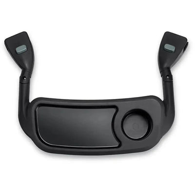 Black plastic snack tray with a cup holder and two side handles, designed for use with a seating arrangement.