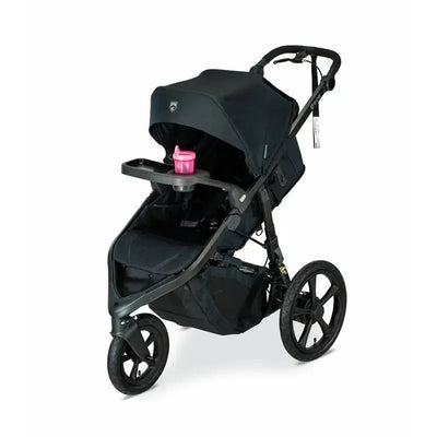BOB Wayfinder Snack Tray attached to a black stroller with a pink cup holder on a flat surface.