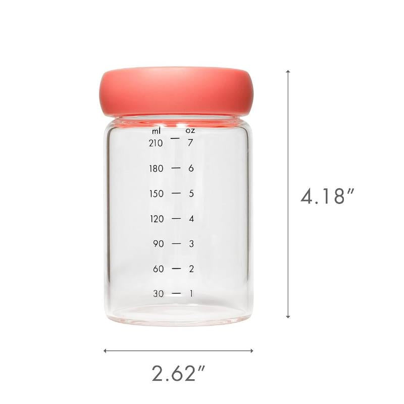 Glass milk storage jar with a pink lid, measuring 4.18 inches tall and 2.62 inches wide, marked with volume measurements.