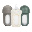 Boon 8 Oz Nursh silicone baby bottles in speckle green, gray, and speckled white with transparent measurement markings.