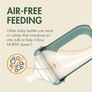Boon 8 oz Nursh silicone baby bottle in speckle green, featuring a design for air-free feeding without vents or valves.