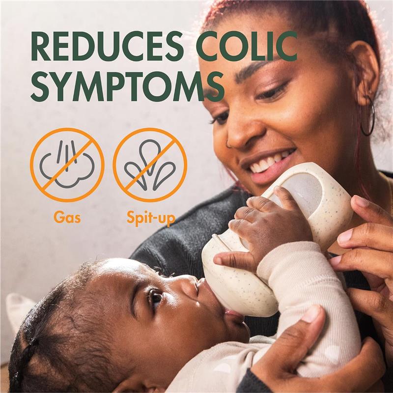 Boon 8 oz Nursh silicone baby bottle in speckle green held by a smiling caregiver feeding a baby, with text promoting colic symptom reduction.