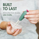 Boon Cacti Bottle Cleaning Brush Set, featuring a green brush with nylon bristles, cleaning a bottle nipple.