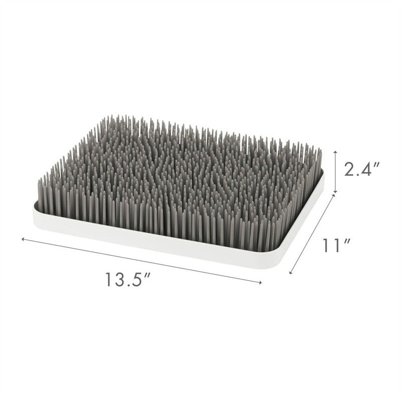Gray and white Boon LAWN countertop drying rack, featuring upright pegs for drying dishes, measuring 13.5 x 11 x 2.4 inches.