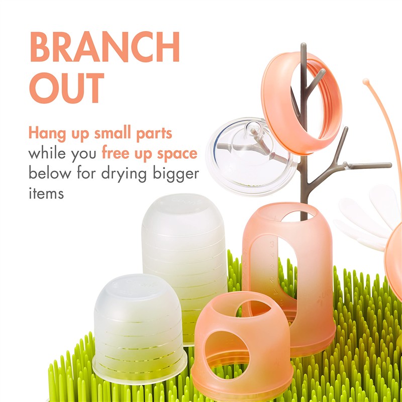 Boon LAWN drying rack featuring TWIG and STEM for hanging small parts, with colorful drying cups and grass-like base.
