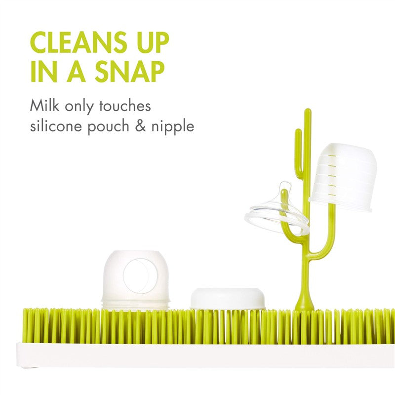 Boon NURSH Silicone Bottle Nipples 3-Pack on a drying rack, featuring bright green bristles and white silicone components.