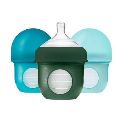 Three 4oz baby bottles in blue and green, featuring clear measurement markings and soft silicone sleeves.