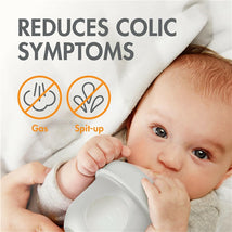 Boon NURSH Silicone Baby Bottle held by an infant, promoting colic symptom relief; text highlights reduced gas and spit-up.