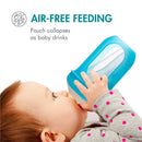Boon NURSH Silicone Pouch Bottle being used by a baby for air-free feeding, showcasing its collapsible design.