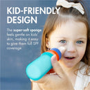 A young girl smiles while a hand applies sunscreen to her face using the Boon YUVI Sunscreen Applicator, featuring a colorful design.