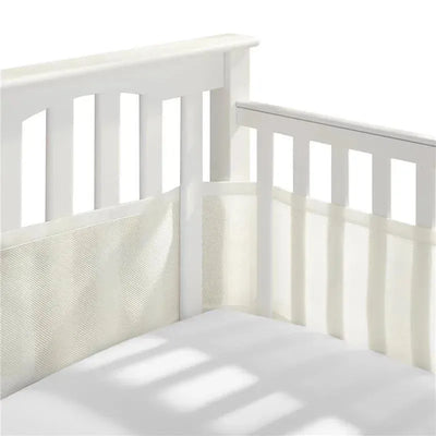 Classic Breathable Mesh Crib Liner in ecru color, shown on a white crib with a soft mattress.