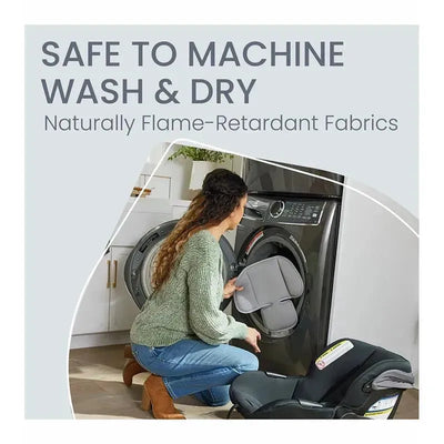 Woman placing a car seat insert into a washing machine, promoting machine washability and flame-retardant fabrics.