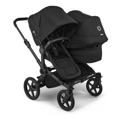 Black Bugaboo Donkey 6 stroller featuring a double seat configuration and adjustable canopies.