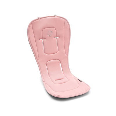 Dual Comfort Seat Liner in Morning Pink, featuring a soft, cushioned design with harness slots for secure seating.