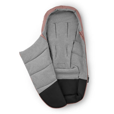 Bugaboo Footmuff in Dusty Pink with a soft gray interior and black bottom, designed for keeping infants warm.