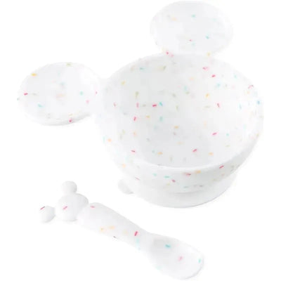 Silicone feeding set featuring a Mickey Mouse design with a bowl, lid, and spoon, decorated with colorful sprinkles.