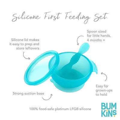 Silicone feeding set for babies and toddlers in blue; includes a bowl with a lid and a spoon, featuring a strong suction base.