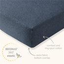 Organic cotton crib sheet in limestone color with 360° elastic, featuring combed cotton and an extra fabric bottom overlap.