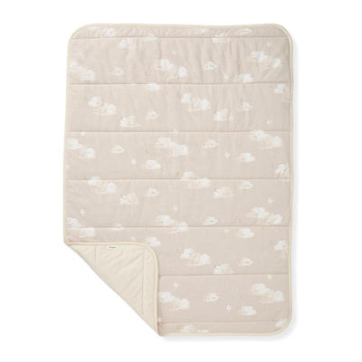Reversible blanket with a limestone color featuring a cloud pattern on one side and a solid color on the other.