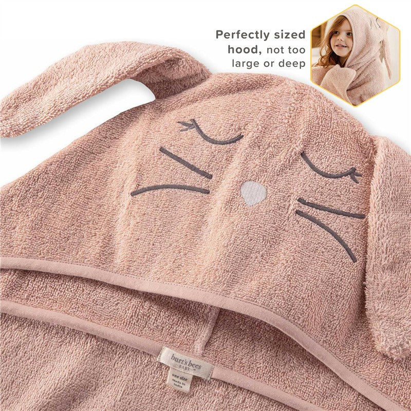 Burts Bees organic cotton toddler hooded bunny towel in soft pink with bunny face and ears, labeled for care.