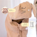 Organic cotton toddler hooded towel in bunny design, featuring soft knit terry material and adorable facial details.