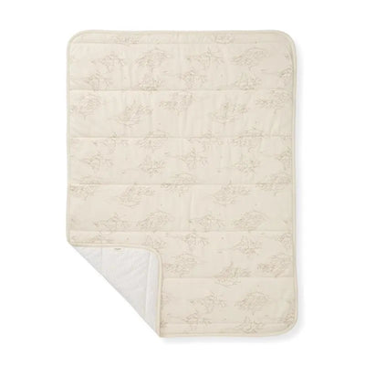 Reversible Burts Bees blanket in oat color, featuring a subtle swaying branches pattern on one side and a solid texture on the reverse.