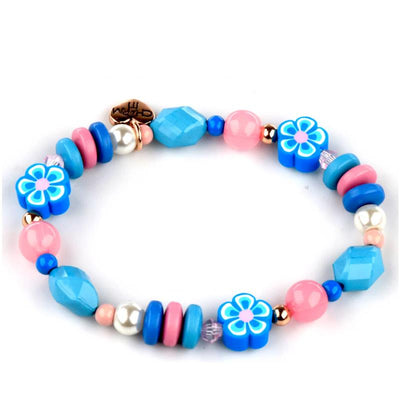 Gold Stitch Stretch Bead Bracelet featuring colorful beads, including floral designs in blue and pink tones.