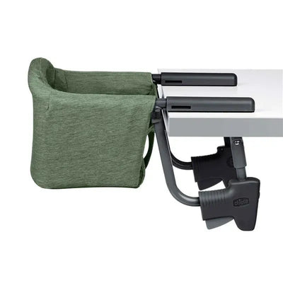 Chicco Fastlock 360 Hook-On Chair in moss color, securely attached to a table with adjustable clamps.