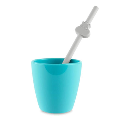 Silicone straw with a cute animal-shaped tip resting in a light blue cup, part of the Chicco Feeding variety pack.