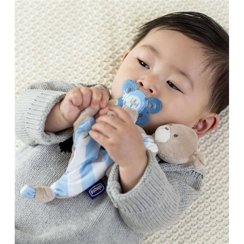 Newborn baby boy blue stroller and teddy bear teether background